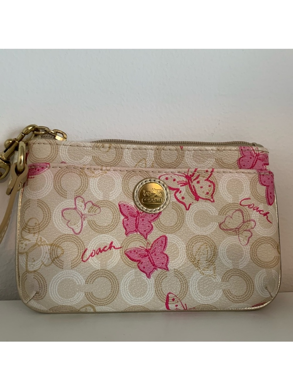 Coach Cream Signature Wristlet with Pink Butterfly Print and Gold Hardware